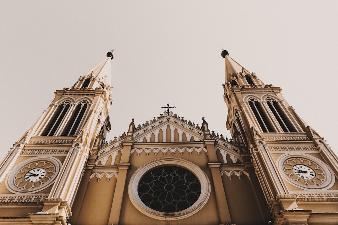 low angle photography of beige concrete building