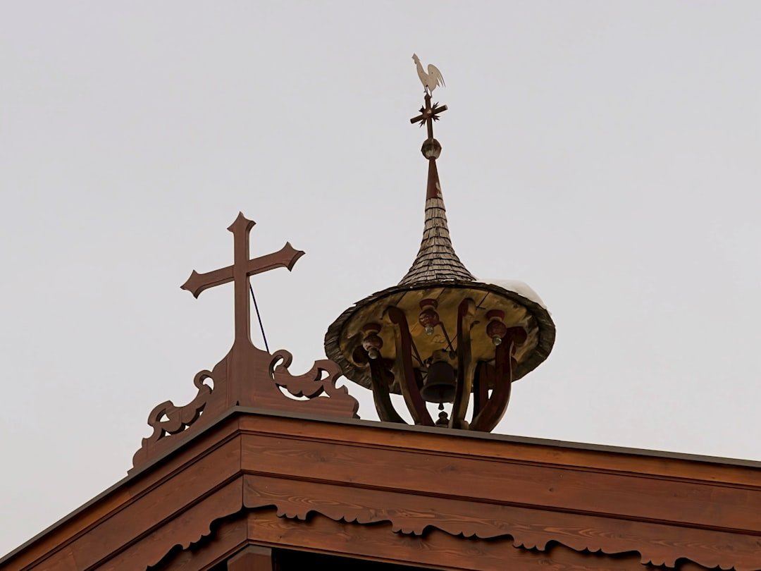 a church steeple with a cross on top
