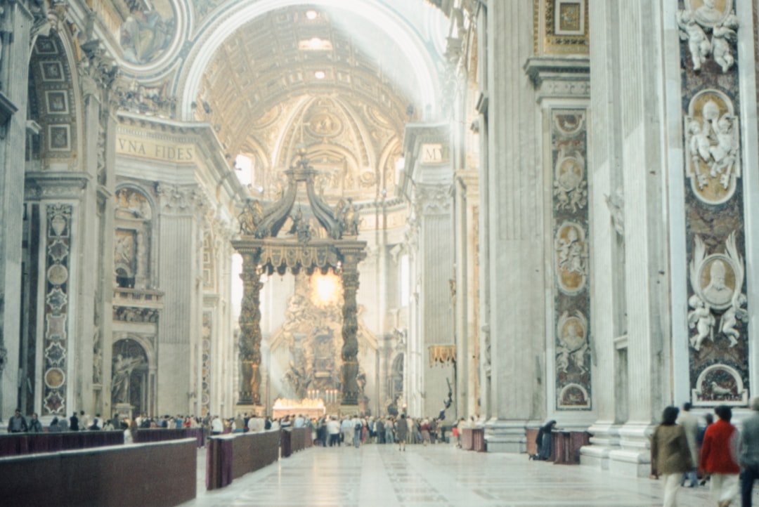 a group of people standing inside of a church