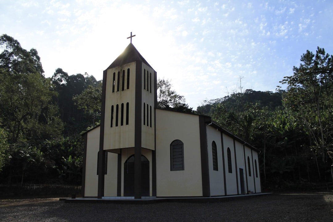 a white church with a cross on top