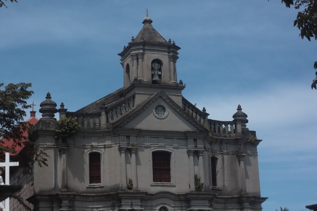 a large white building with a bell tower