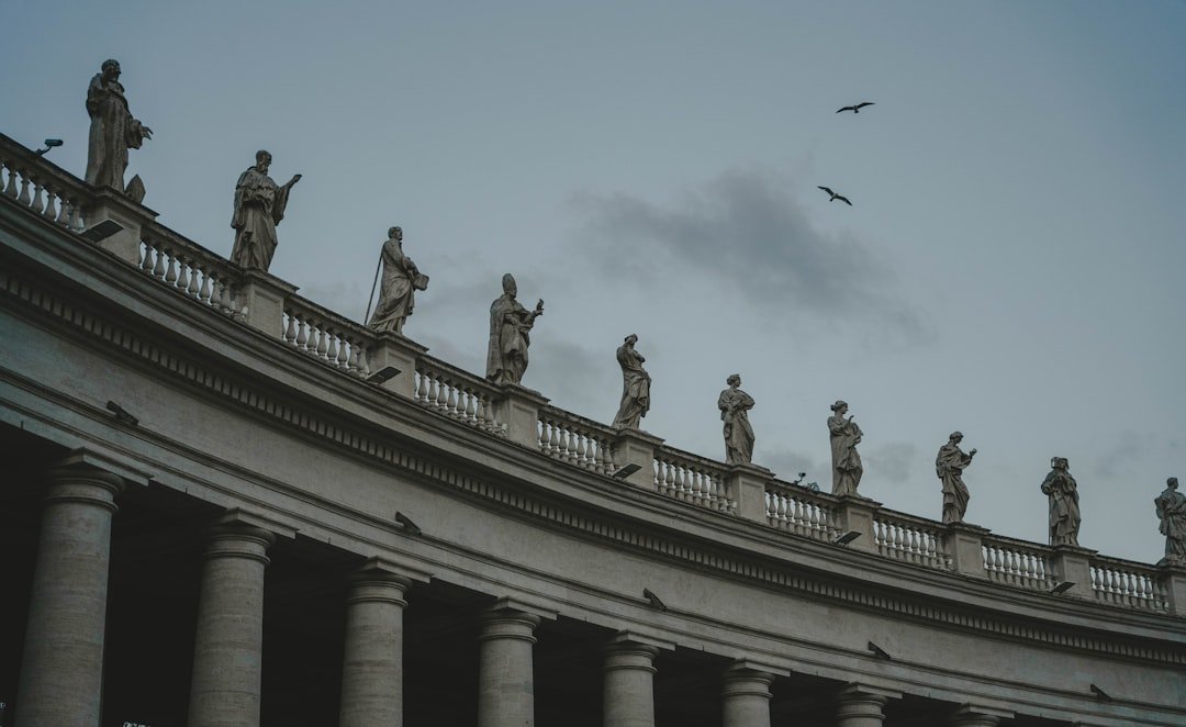 a group of statues on top of a building