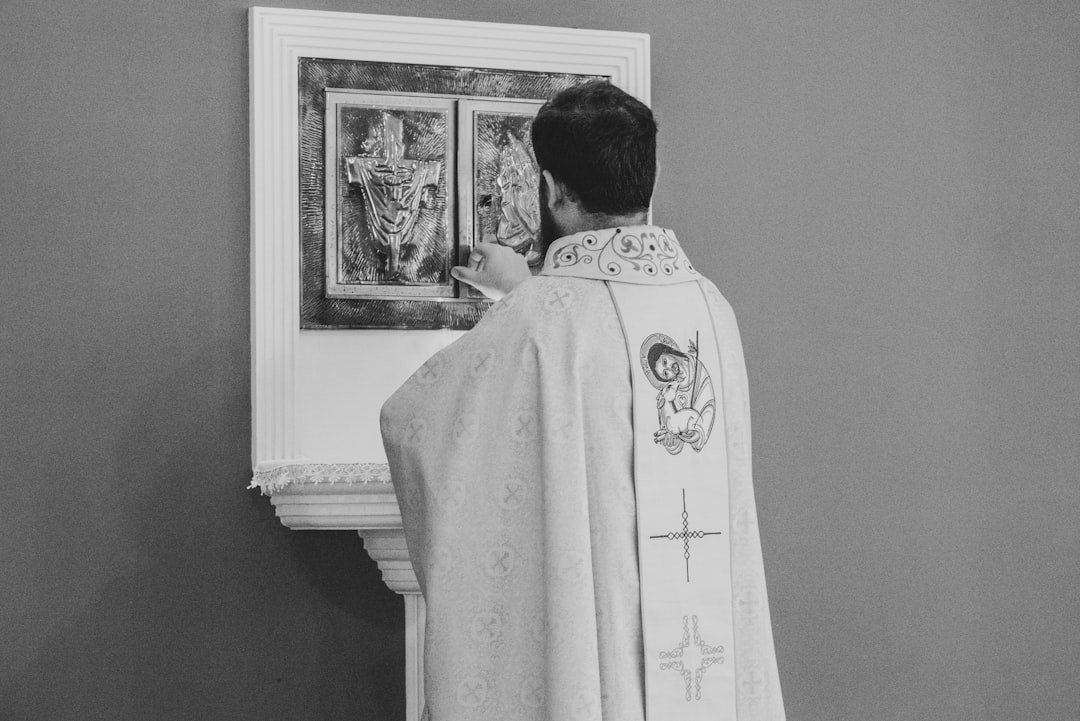 A man standing in front of a painting