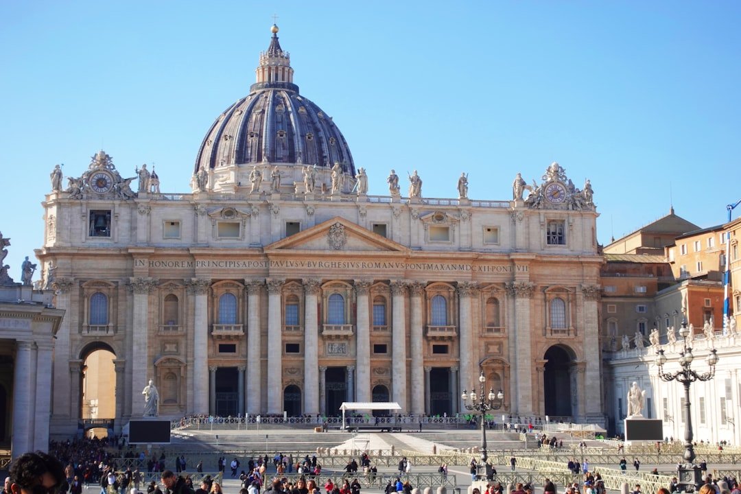 St. peter's basilica stands tall in the sunlight.