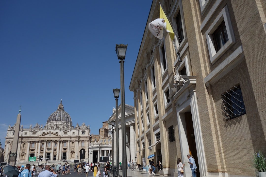 St. peter's basilica dome under a clear blue sky.