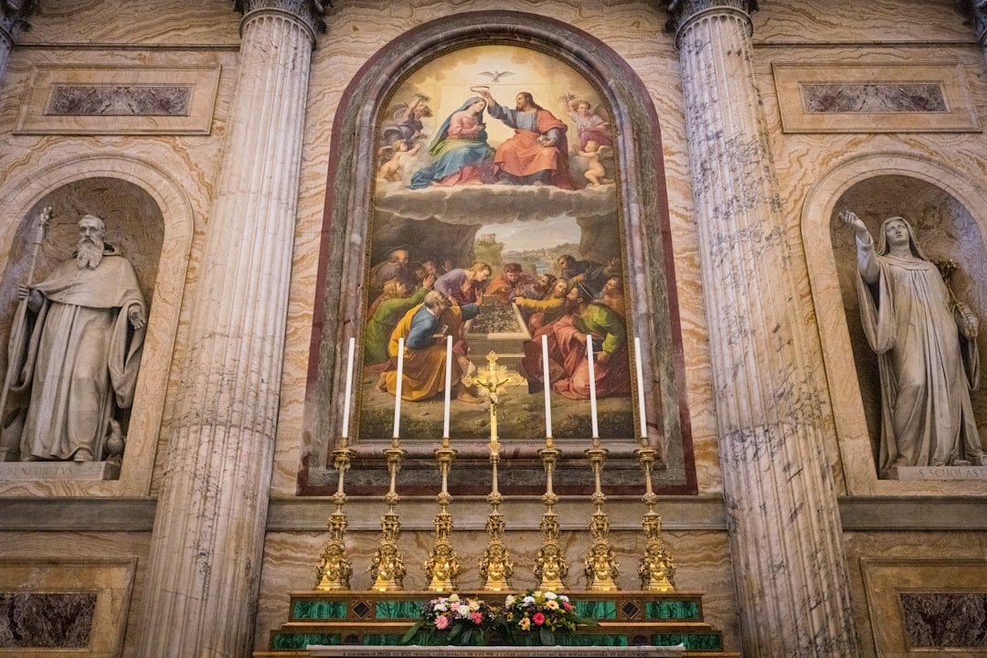 Altar with religious painting and statues in church