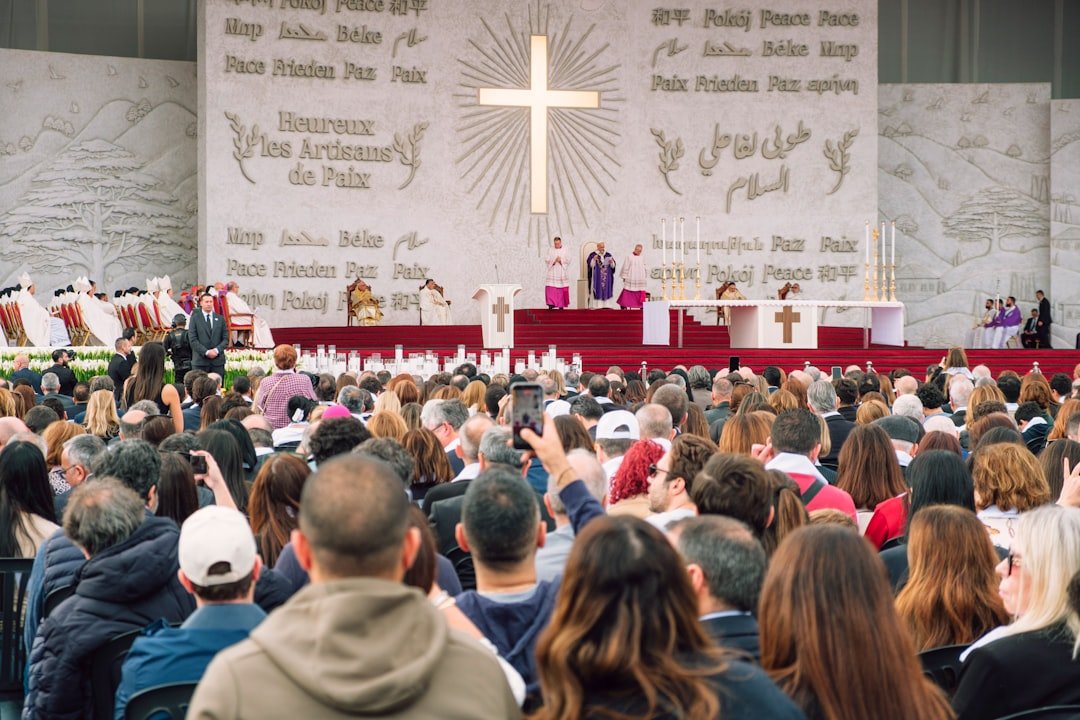 A religious ceremony with a large crowd gathered
