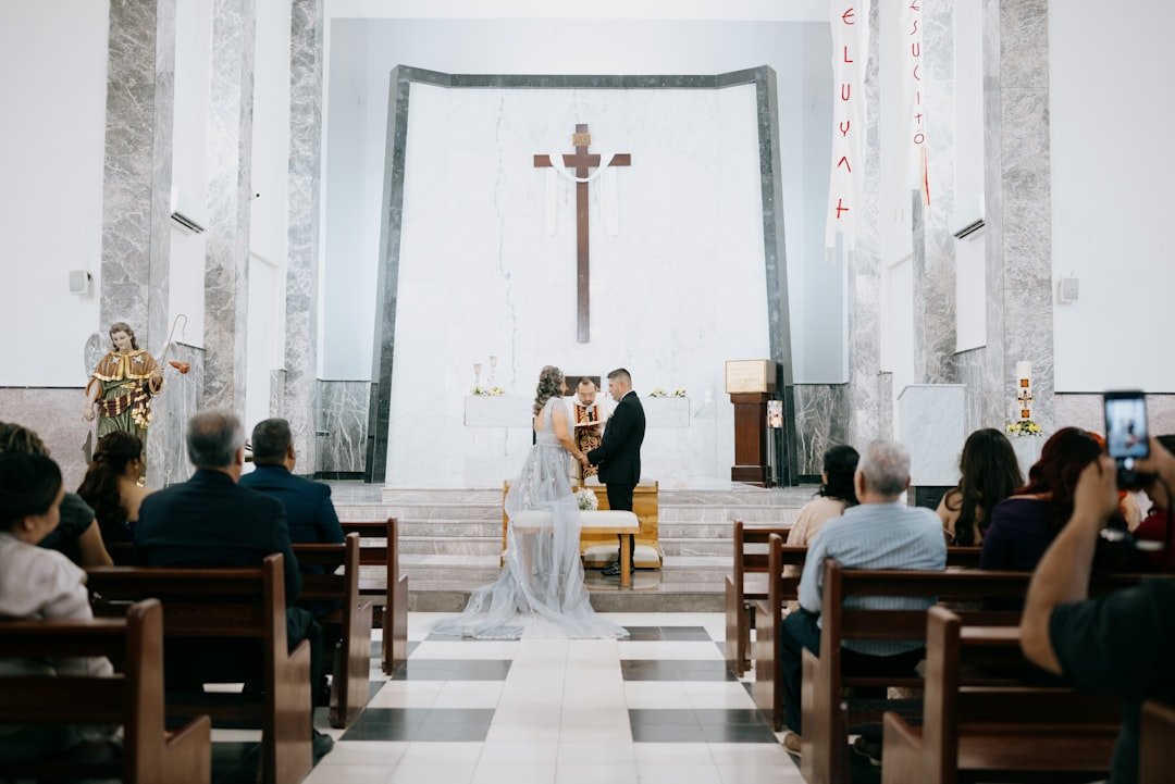 Wedding ceremony in a church with guests watching